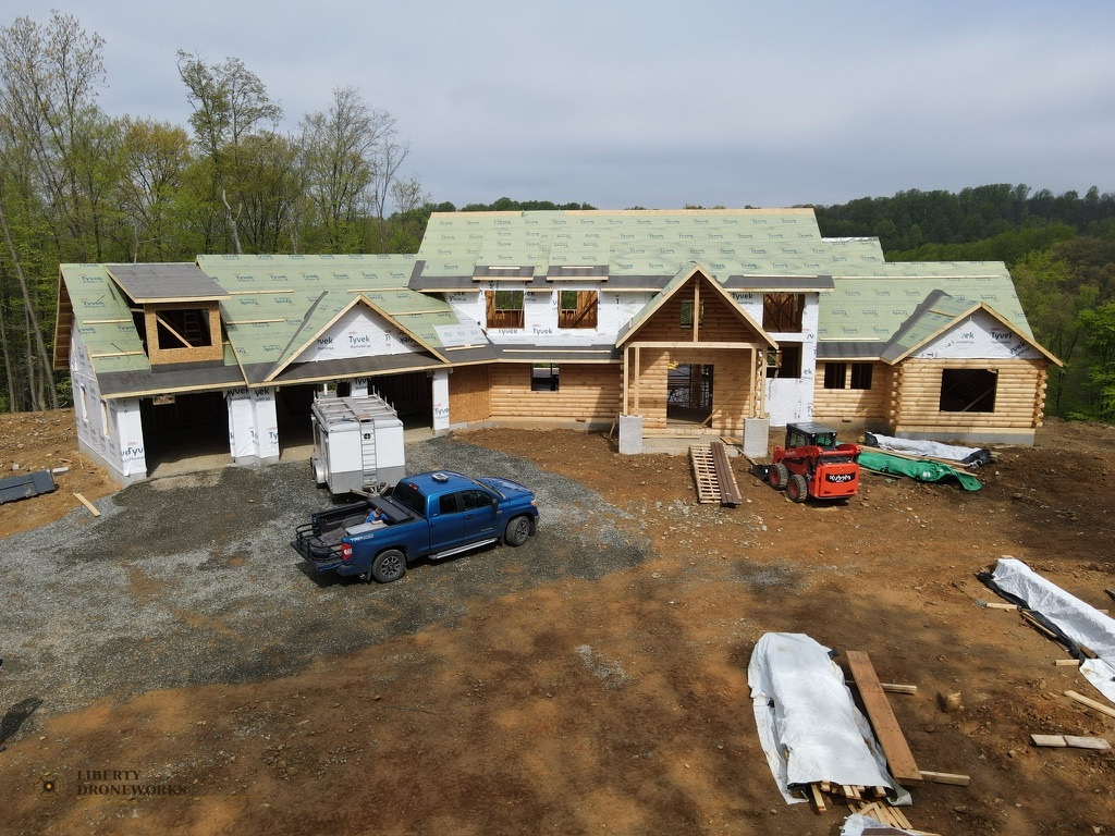 Aerial view of log cabin construction in Mt. Penn Pennsylvania showing roof progress