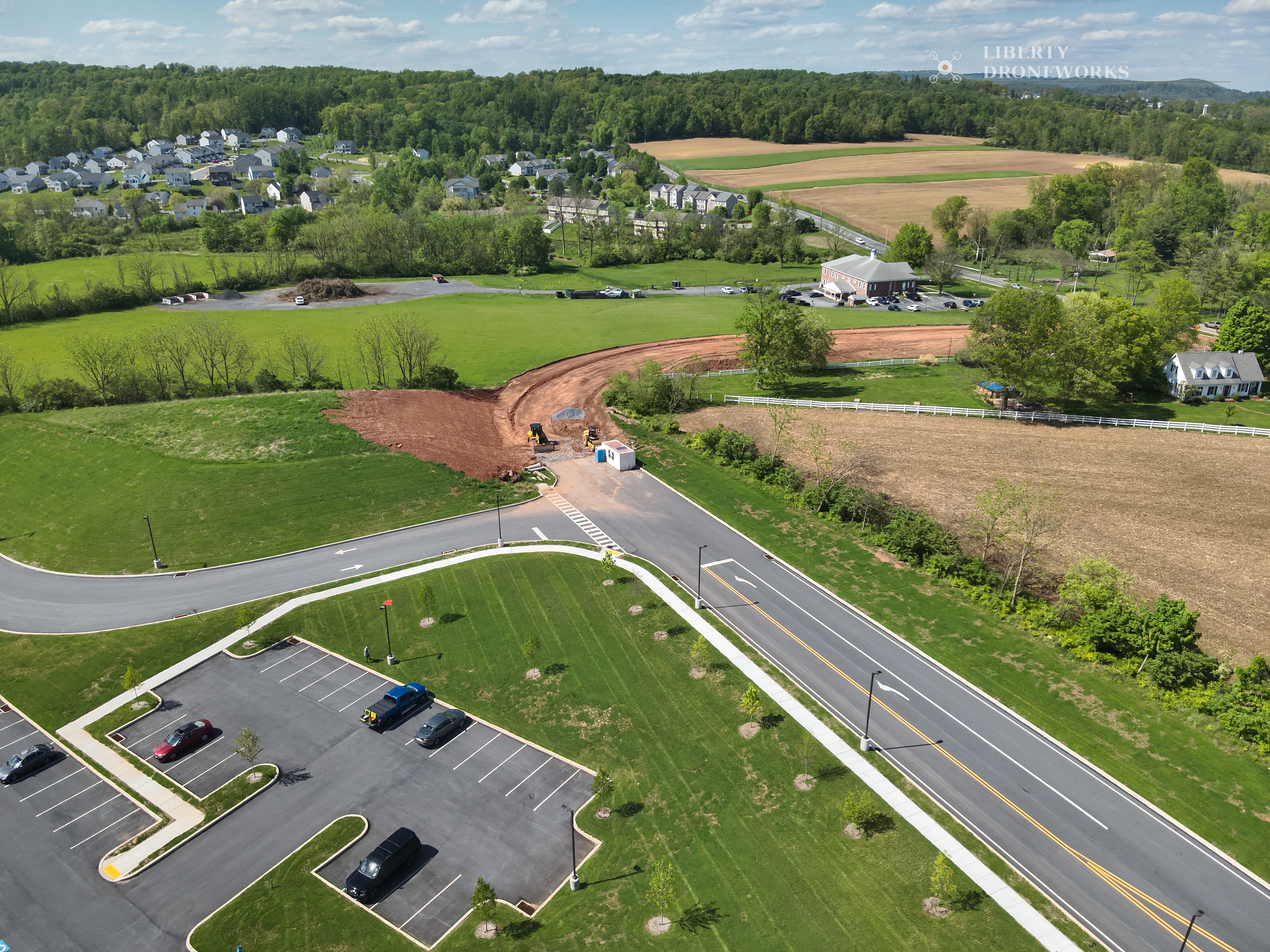 Aerial overview of Hill Road construction site showing site context