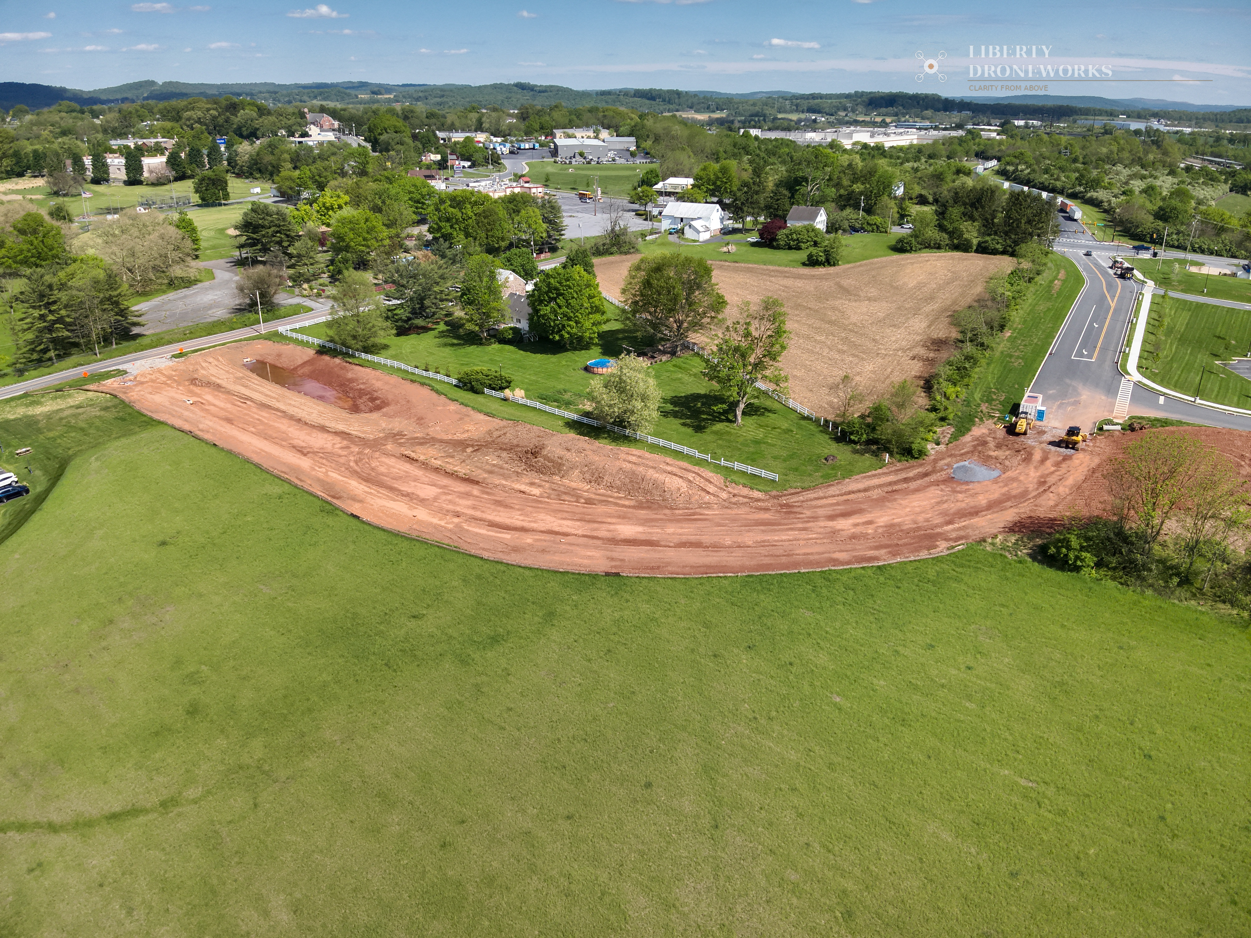 Aerial photo showing site grading curves and road alignment