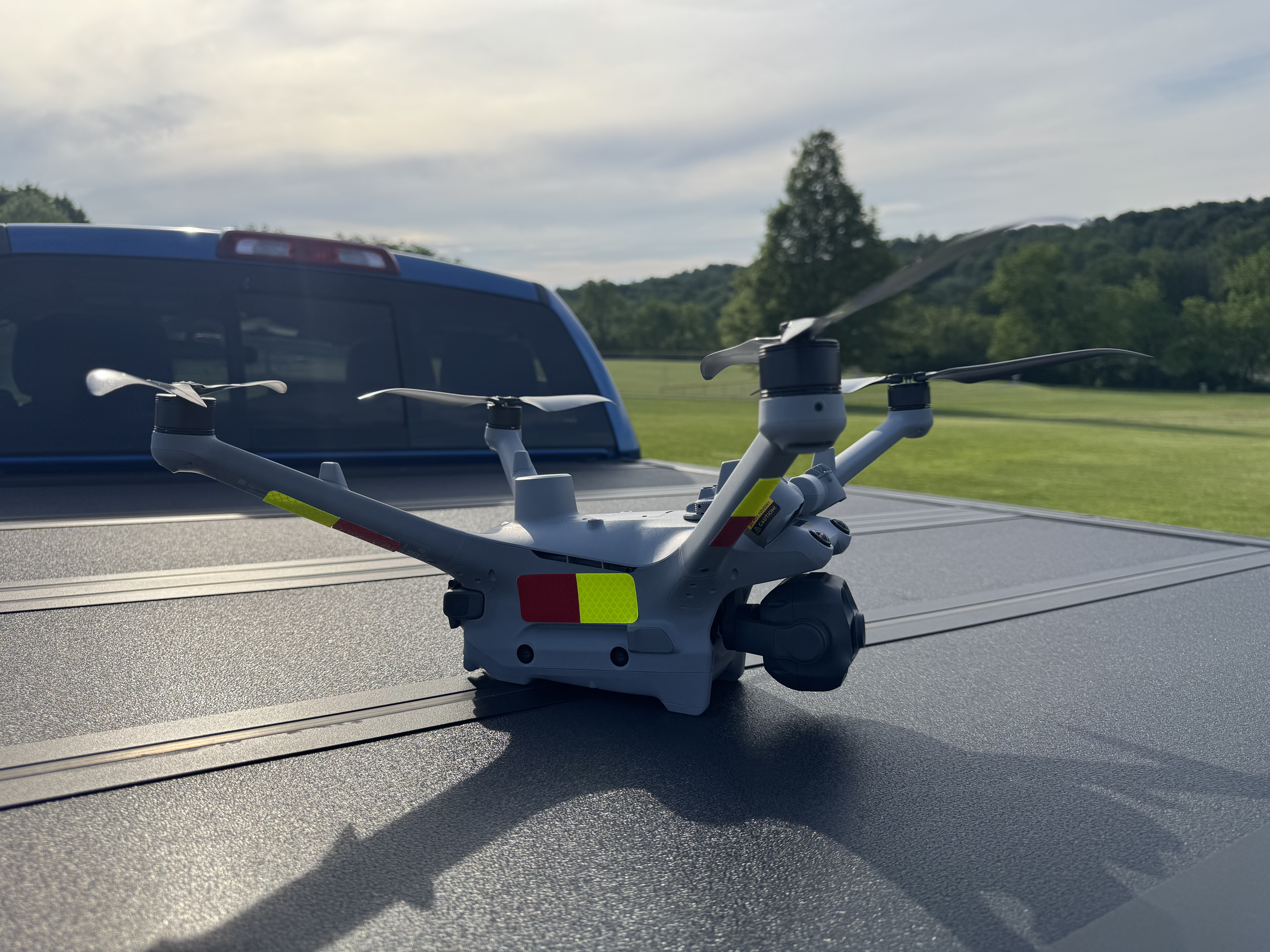 DJI Matrice 4TD folded and ready for deployment on truck bed
